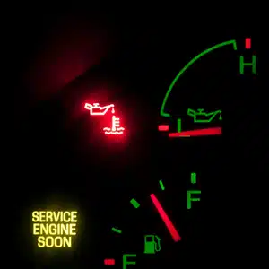 Close-up of dashboard lights with bmw warning signs like oil and engine service alerts