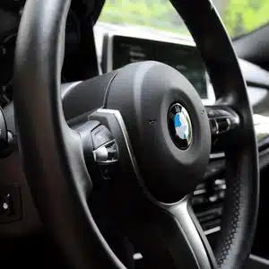 BMW interior showing steering wheel and gauges where bmw warning signs may appear during driving